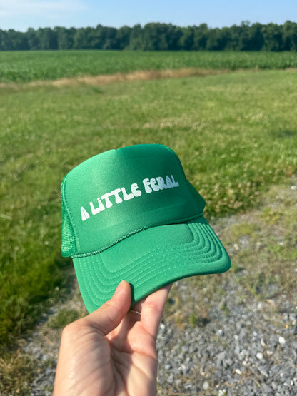 A LITTLE FERAL TRUCKER HAT